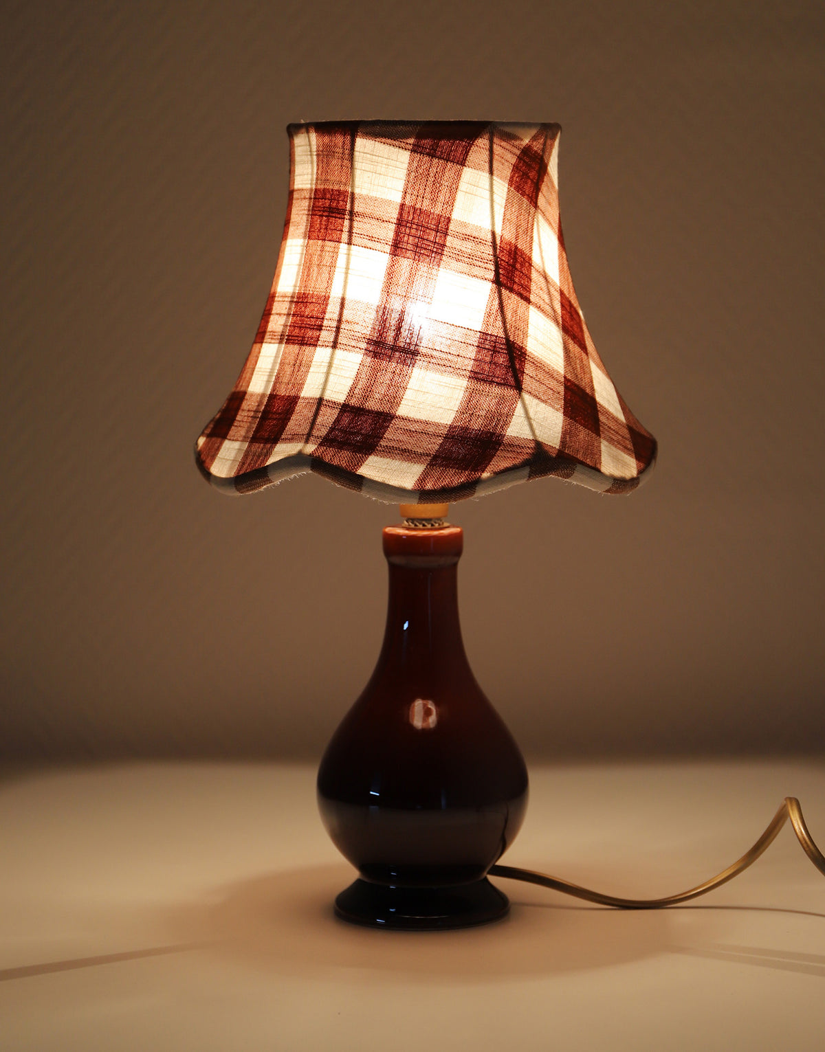 Upcycled vintage lamp — antique bronze candlestick base and graphic floral pattern