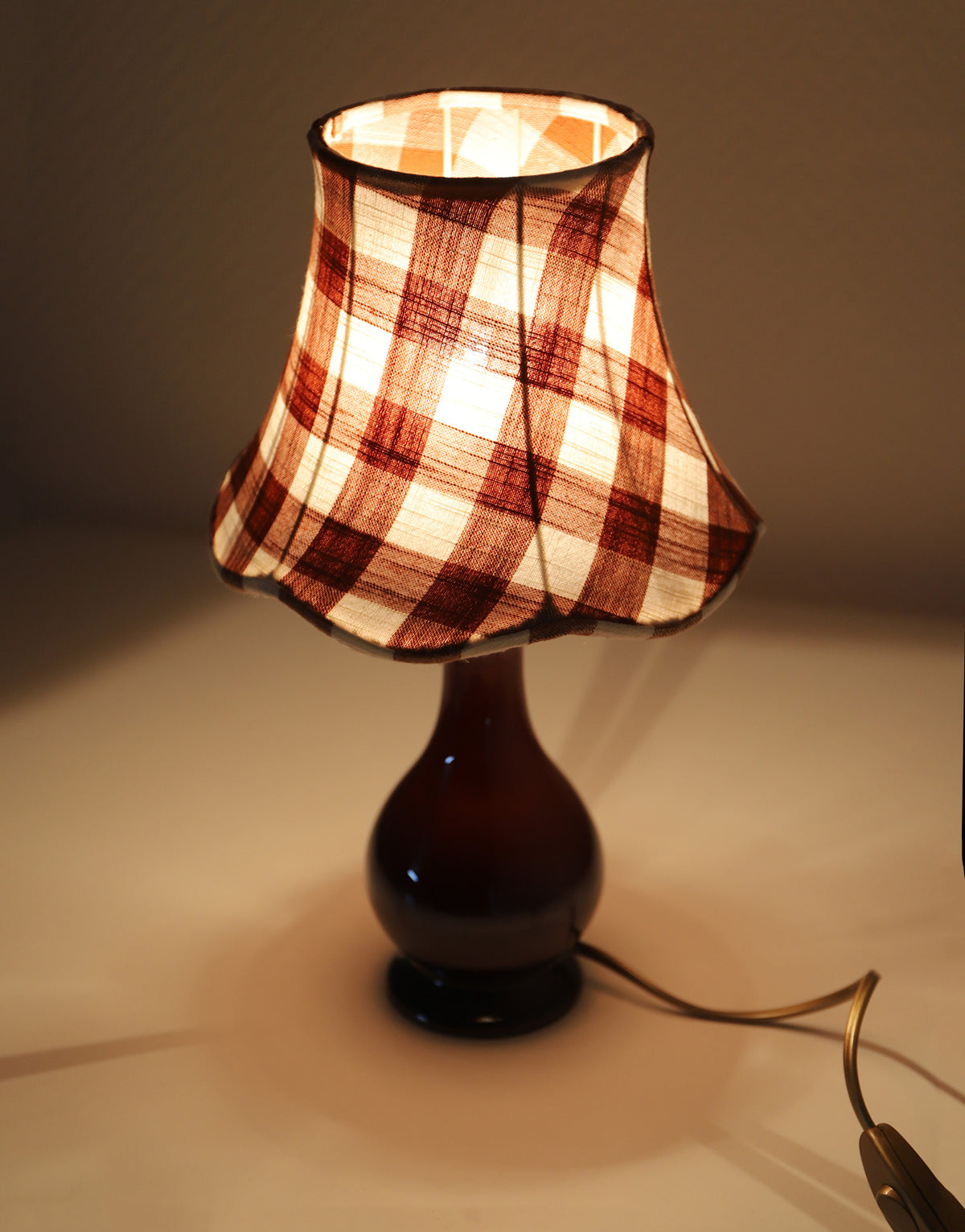 Upcycled vintage lamp — antique bronze candlestick base and graphic floral pattern