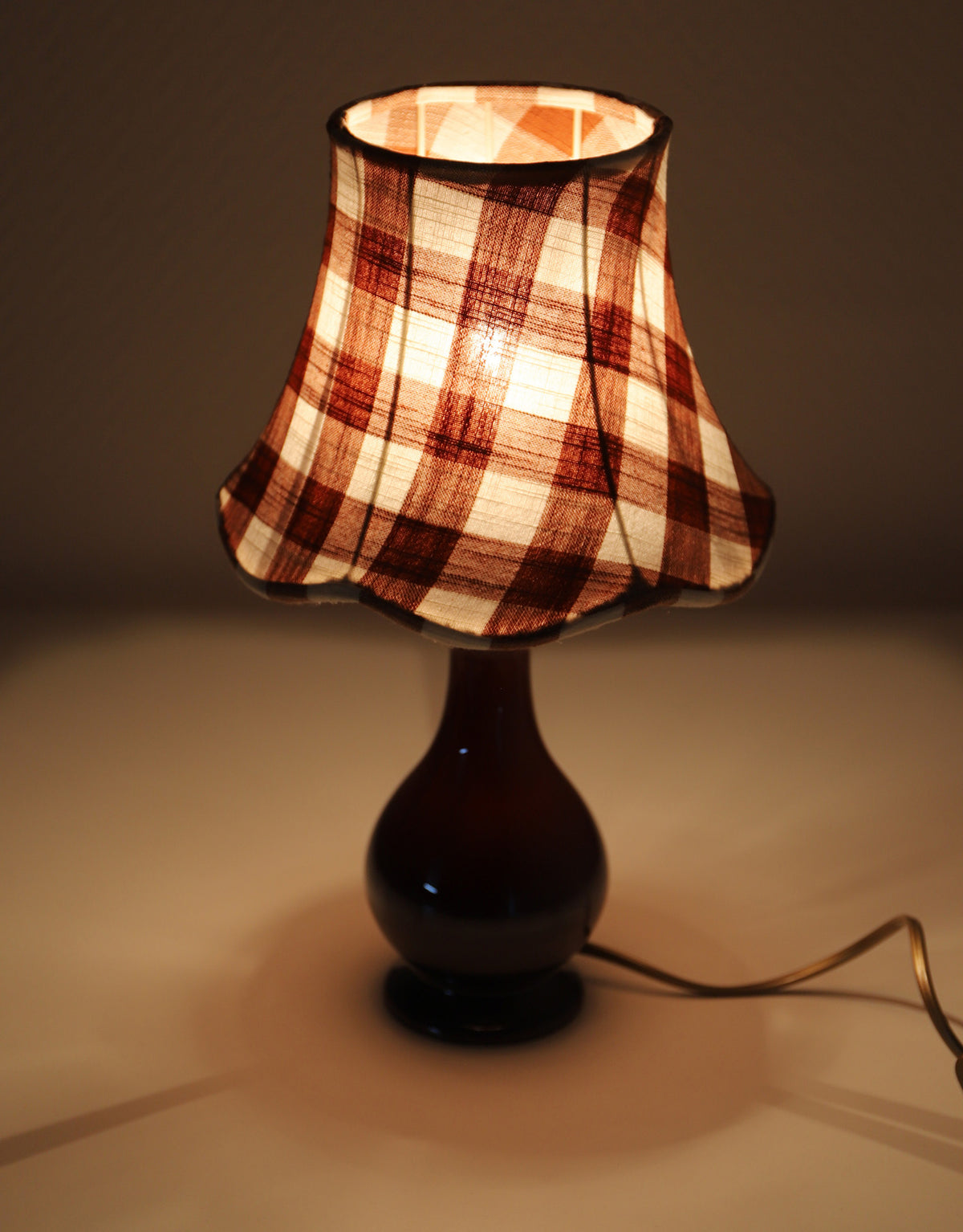 Upcycled vintage lamp — antique bronze candlestick base and graphic floral pattern