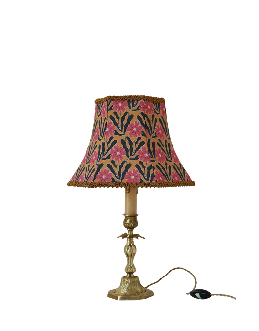 Upcycled vintage lamp — antique bronze candlestick base and graphic floral pattern