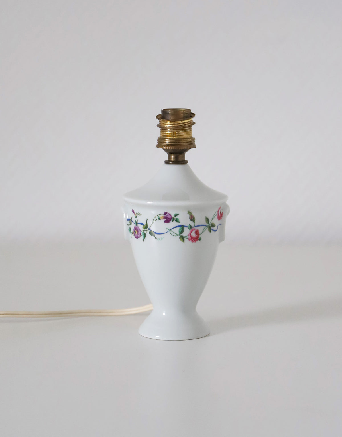 Upcycled vintage lamp — antique bronze candlestick base and graphic floral pattern