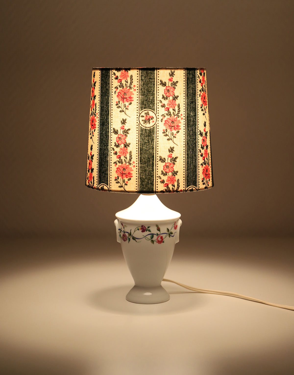 Upcycled vintage lamp — antique bronze candlestick base and graphic floral pattern